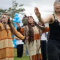 Culture Camp dancers, some dressed in cultural regalia